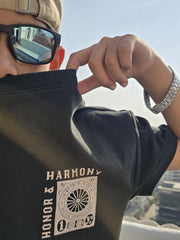 Honour and Harmony hunter green oversized men’s t-shirt front view on model, round neck half sleeves, organic cotton 210 GSM